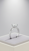 Platinum solitaire engagement ring with classic four-prong setting